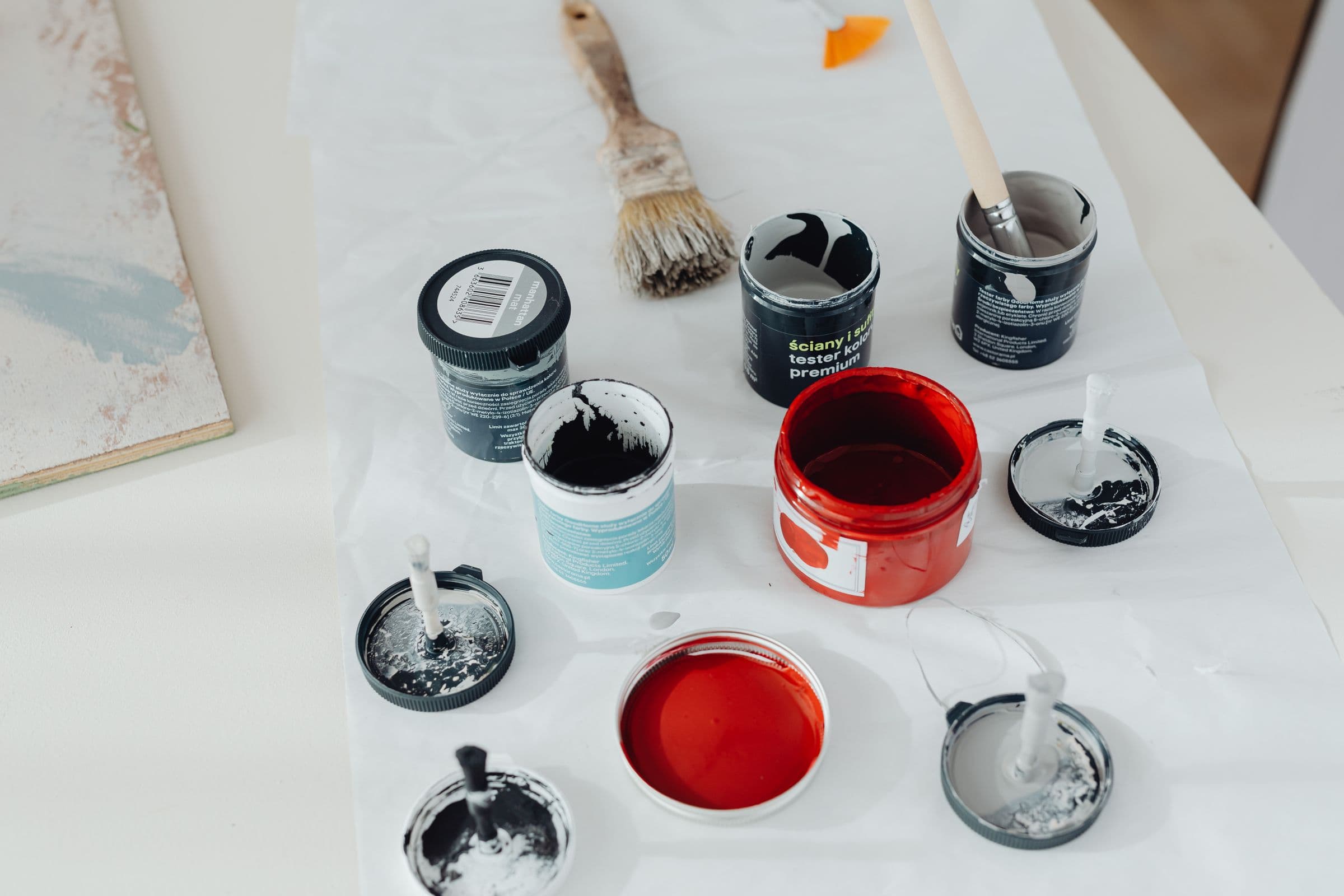 Paint cans, brushes, and tools of the DuraCoat trade
