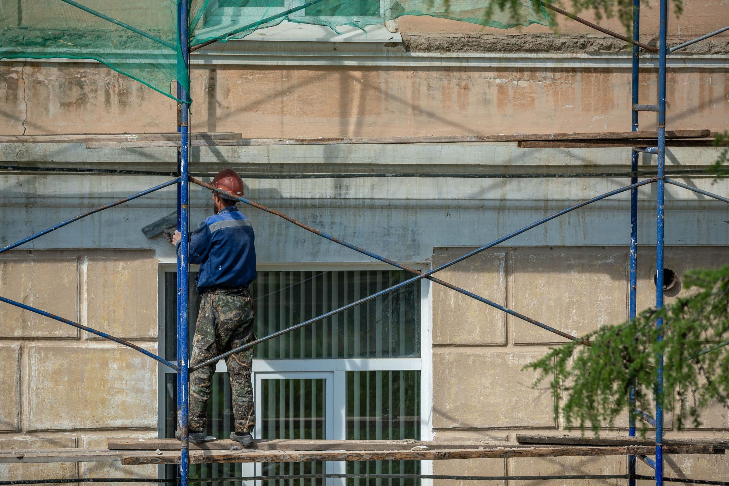 Scaffolding erected against a building under renovation